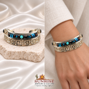 Fred Begay multi-stone inlay cuff on pale stone and fitted around a wrist